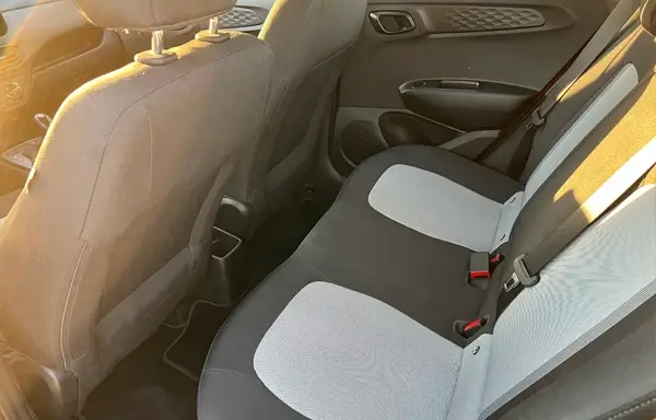 Spacious rear seats in the Hyundai i10. Comfortable seating for passengers with ample legroom.